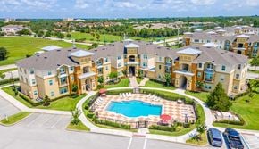 Port St. Lucie apartment for rent - an aerial view of an apartment complex with a swimming pool