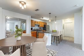 Port St. Lucie apartment for rent - a kitchen and dining area with a table and chairs