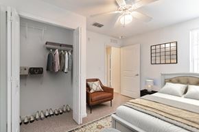 Port St. Lucie apartment for rent - a bedroom with a bed and a ceiling fan