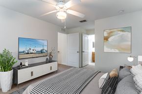 Rockledge apartment for rent - a bedroom with a large bed and a ceiling fan