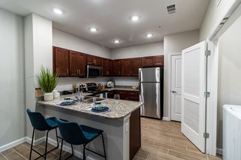 Open kitchen with breakfast bar and pantry