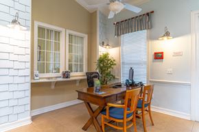 New Smyrna Beach apartment for rent - clubhouse with table and chairs with a cafe feel