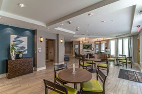 Orange City apartment for rent - a resident clubhouse with tables and chairs