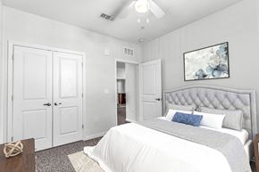 Orange City apartment for rent - a bedroom with a bed and a ceiling fan