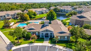 Kissimmee apartment for rent - a large house with a swimming pool in front of it