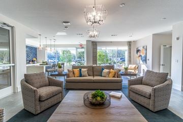 Orange City apartment for rent - the preserve at ballantyne commons living room with couches and chairs