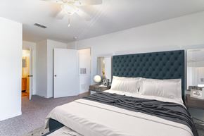 Orlando apartment for rent - a bedroom with a large bed and a ceiling fan