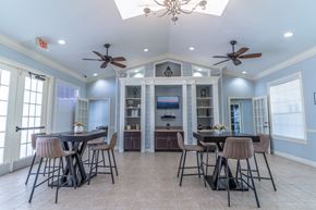 Orlando apartment for rent - clubhouse area with tables and tv