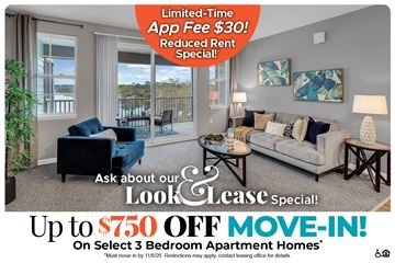 Longwood apartment for rent - A living room with a couch, chair, and a coffee table is on a real estate advertisement.