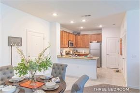 Orlando apartment for rent - A dining room with a table set for a meal.