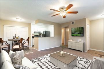 Winter Garden apartment for rent - A living room with a dining table and a television.
