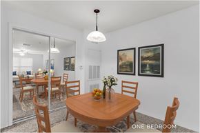 Tampa apartment for rent - A dining room with a wooden table and chairs.