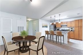 Kissimmee townhouse for rent - A dining room with a table and chairs.