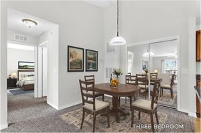 Kissimmee apartment for rent - A dining room with a table set for four.