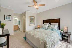 Lady Lake apartment for rent - A bedroom with a bed and a ceiling fan.