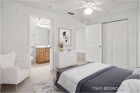 Orlando apartment for rent - A bedroom with a large bed and a chair.