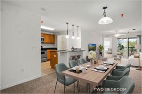 Orlando apartment for rent - A dining room with a table set for two and chairs around it.
