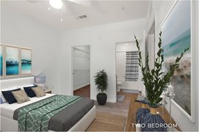 Oviedo apartment for rent - A bedroom with a bed, a plant, and a painting on the wall.