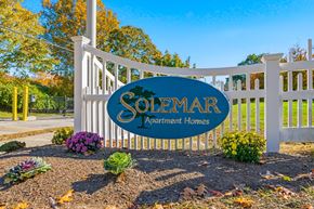 South Dartmouth apartment for rent - A sign for Solemar Apartment Homes is displayed in front of a white fence.
