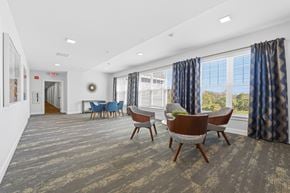 South Dartmouth apartment for rent - A conference room with a long table and chairs.