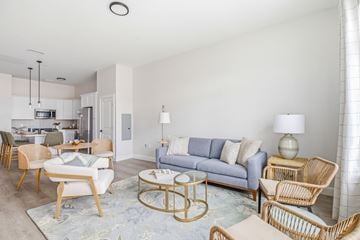South Dartmouth apartment for rent - A living room with a grey couch and a coffee table.