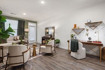 Huntersville apartment for rent - A living room with a white chair and a white sofa.
