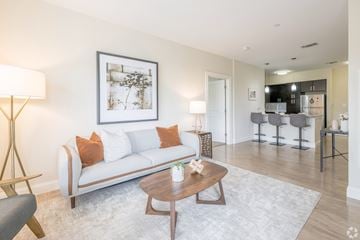 Bridgewater apartment for rent - A living room with a white couch and a framed picture on the wall.