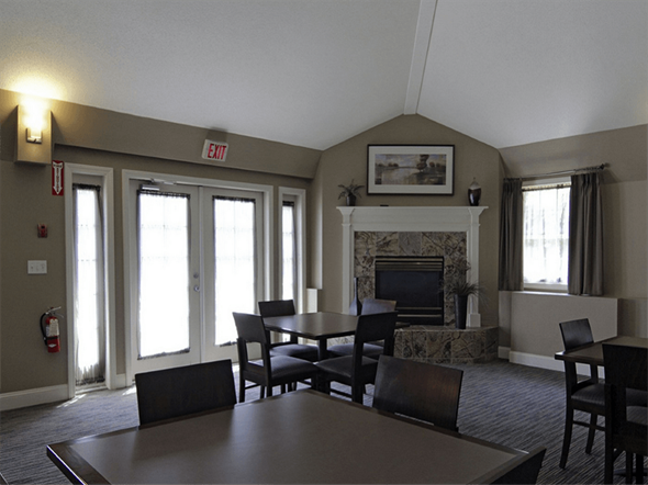 Fall River apartment for rent - a living room with a table and chairs and a fireplace