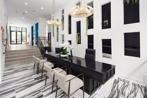 Atlanta apartment for rent - Bright and Bold Reception Space with Monochrome Flooring and Custom Wall Niches
