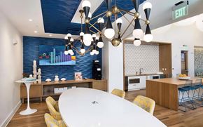 Tampa apartment for rent - Community Lounge with TV, Coffee Station, and Modern Lighting Fixtures