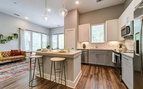 Morrisville apartment for rent - Large Open Kitchen with Island Seating, Stainless Steel Appliances, and Pendant Lighting