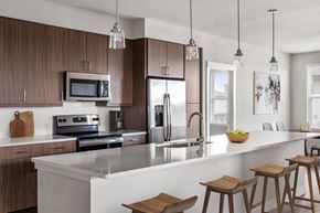 Arvada apartment for rent - Gateway Arvada Ridge Gourmet Kitchen with Stainless Steel Appliances and Pendant Lighting