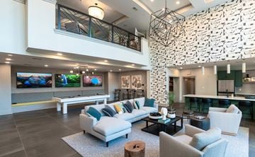 Raleigh apartment for rent - a living room with couches and chairs and a pool table