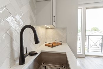 Stainless steel sink with faucet in kitchen
