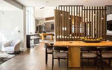 Atlanta apartment for rent - a dining room and living room with a wooden table and chairs