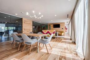 Austin apartment for rent - Meeting Lounge with Natural Light, Artistic Bar, and Modern Chairs