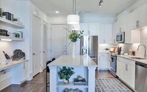 Alpharetta apartment for rent - Apartment Kitchen with Island Storage, Shelves, and Stainless Steel Appliances