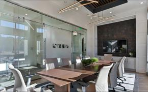 Alpharetta apartment for rent - Resident Meeting Room with Rolling Chairs, TV, and Accent Wall