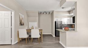 Palm Beach Gardens apartment for rent - A modern kitchen with a dining table and chairs.