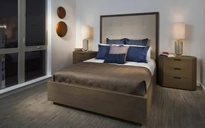 Seattle apartment for rent - Bedroom with a King-Size Bed Featuring Window View and Bedside Storage