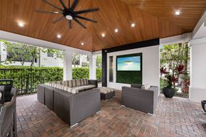 Pembroke Pines apartment for rent - A patio with a ceiling fan and a couch.