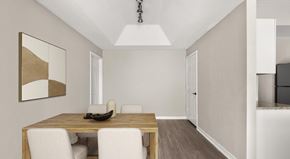 Palm Beach Gardens apartment for rent - A dining room with a wooden table and white chairs.