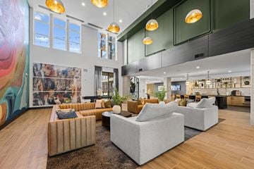 Charlotte apartment for rent - A modern living room with a large abstract painting on the wall.