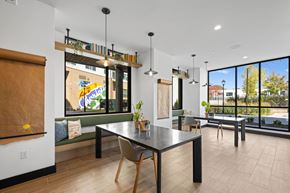 Charlotte apartment for rent - A modern dining room with a table and chairs.