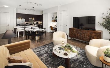 Atlanta apartment for rent - a living room and kitchen with a couch and chairs