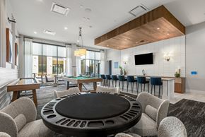Centennial apartment for rent - Resident Lounge with Bar Seating, Game Tables, and Access to Patio Views
