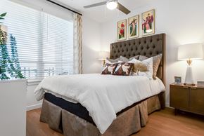 Centennial apartment for rent - Bright Bedroom with Tufted Headboard and Large Windows for Natural Light