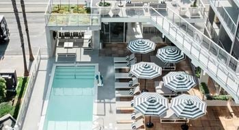 Patio with swimming pool and chaise loungers