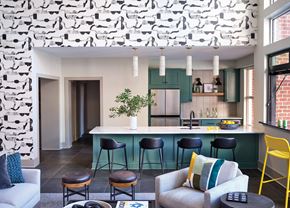 Raleigh apartment for rent - Modern Community Kitchen with Green Cabinetry, Bar Seating, and Lounge Area