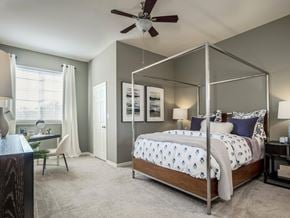 Saint Petersburg apartment for rent - Bedroom with modern canopy bed, desk nook and natural light